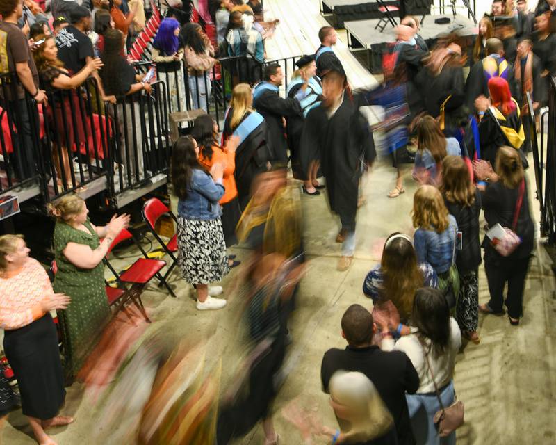 DeKalb High School seniors exit the graduation ceremony during the recessional portion of the event on Saturday May 23, 2026, held at the Convocation Center in DeKalb.