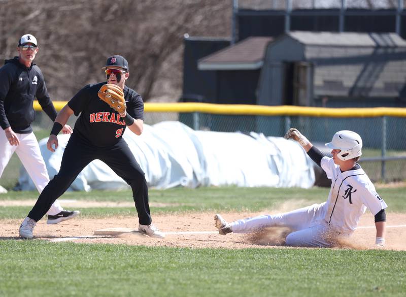 Kaneland's Brady Alstott advances to third on a wild pitch as DeKalb's Isaac Black waits for a throw during their game Saturday, April 12, 2025, at Kaneland High School in Maple Park.