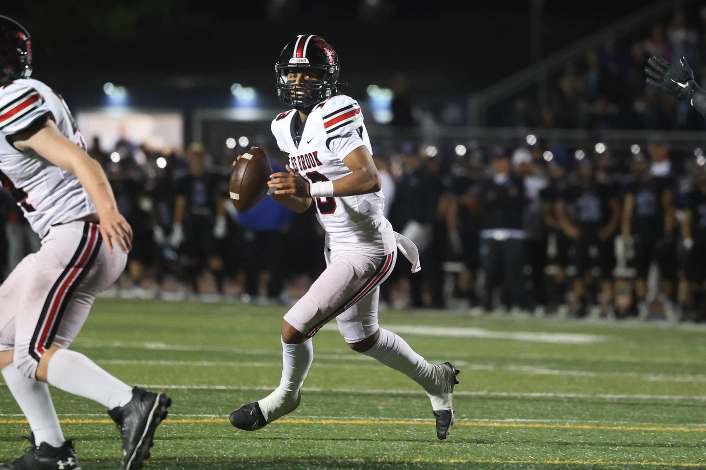 Bolingbrook’s Jonas Williams looks to pass against Lincoln-Way East. Friday, Sept. 23, 2022, in Frankfort.
