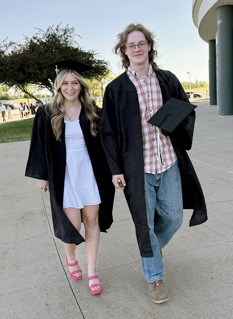Neighbors and best friends, Alex Polyak and Joey Hendry head into the NIU Convocation Center for their graduation on Sunday, May 18, 2025.