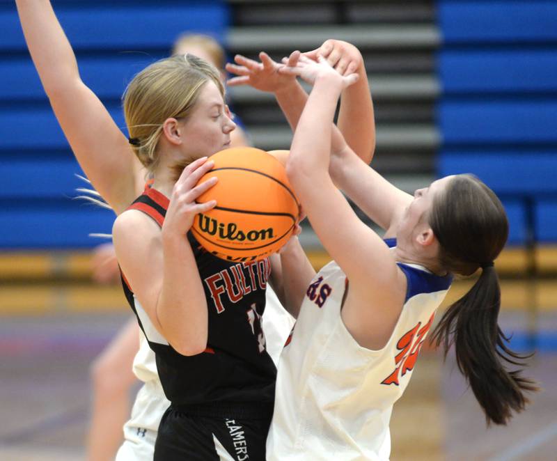 Fulton's Hailey Smither (13) and Eastland's Sienna Peterson (22) battle for the ball during a Friday, Dec. 13, 2024 game at Eastland High School in Lanark.