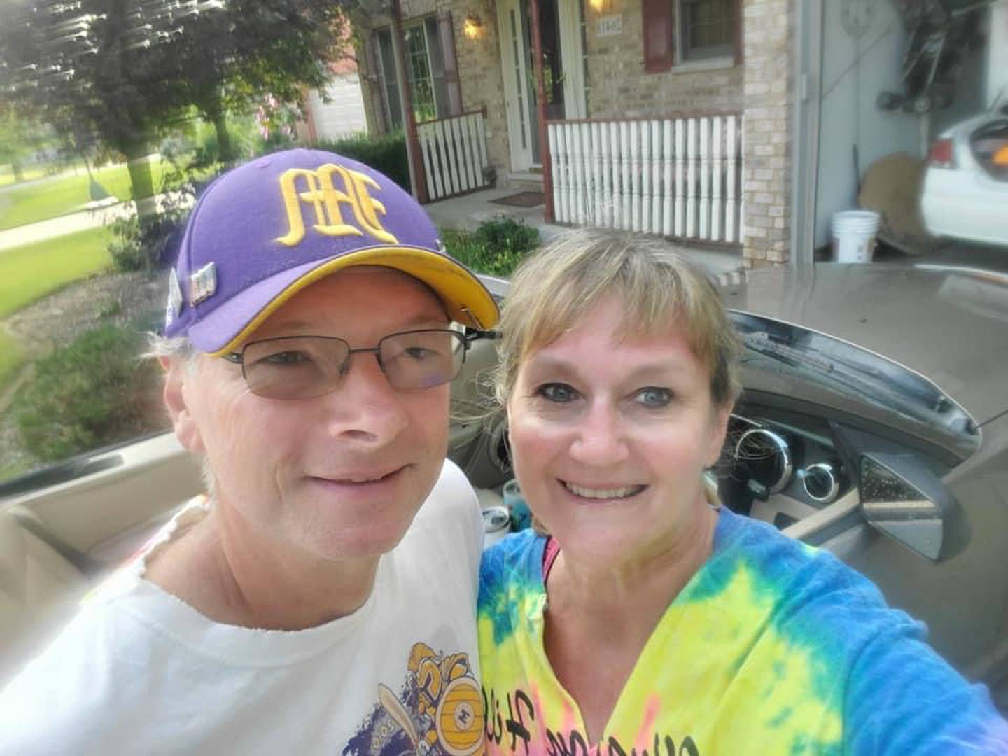 Brian and Patti Blumhorst and their Mustang convertible