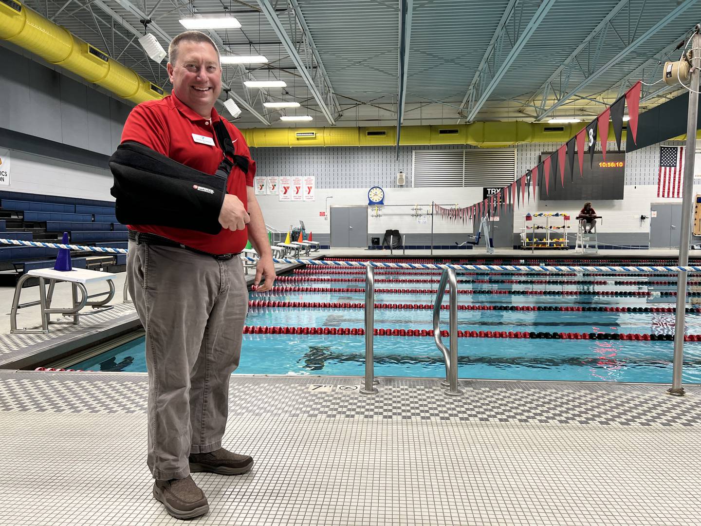 On Friday, April 28, 2023, former head coach of the DeKalb County Swim Team, Brian Bickner, stands next a Kishwaukee Family YMCA pool, a week after officially starting as the facilities chief executive officer.