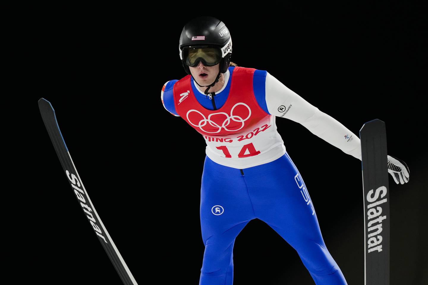 Kevin Bickner, of the United States, soars through the air during a men's large hill qualification round at the 2022 Winter Olympics, Friday, Feb. 11, 2022, in Zhangjiakou, China. (AP Photo/Andrew Medichini)