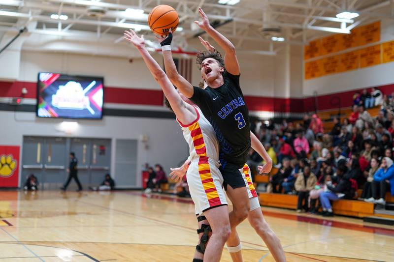 Burlington Central's Lucas Kerr (3) is fouled while shooting the ball against Batavia’s Josh Kahley (11) during a Batavia Night of Hoops Basketball game at Batavia High School on Saturday, Jan. 25, 2025.