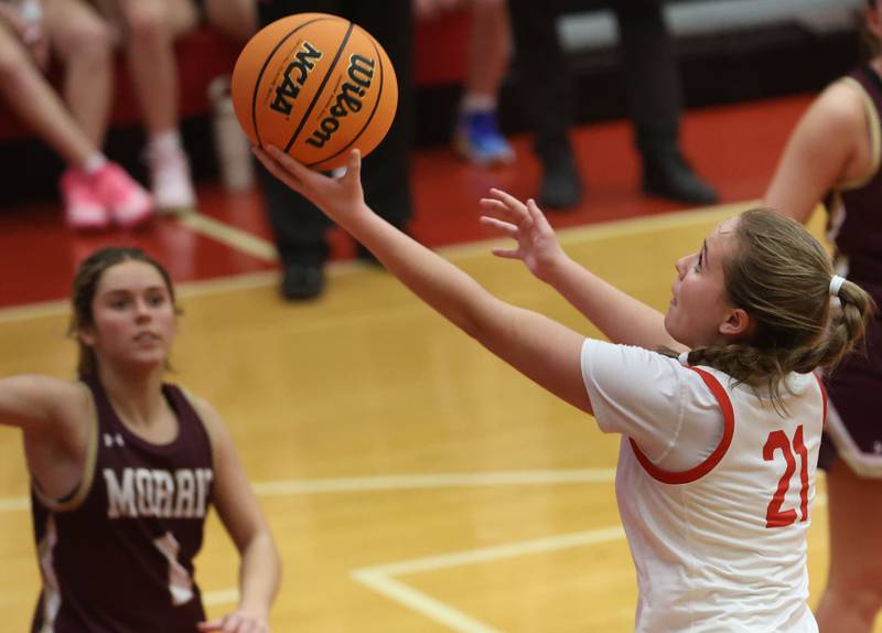 Ottawa's Hailey Thrush runs in for a layup against Morris on Tuesday, Dec. 9, 2025 in Kingman Gymnasium at Ottawa High School.
