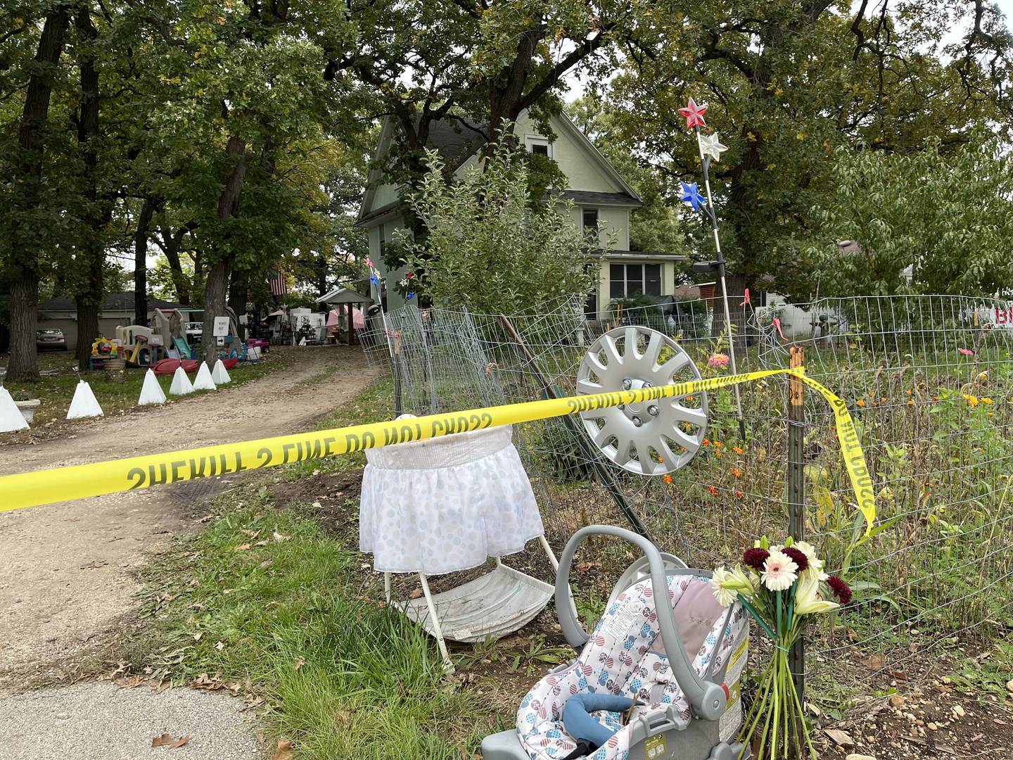 The taped-off driveway to the Plainfield Township residence where a 6-year-old victim was stabbed to death on Oct. 14, 2023. The boy's mother was also attacked as well but survived. Joseph Czuba, 71, has been charged with the first-degree murder of the boy and attempted first-degree murder of the mother.
