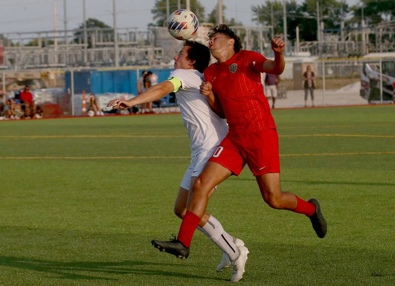 Kaneland's Michael Happ and L-P's Giovanni Garcia bump in the air for a header on Monday, Aug. 28, 2023 at the L-P Athletic Complex in La Salle