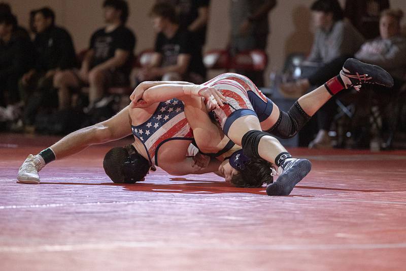 Dixon’s Doolan Long and Morrison’s Jake Updike go head to head in the 132 pound weight class in the Class 1A wrestling sectionals at Oregon.