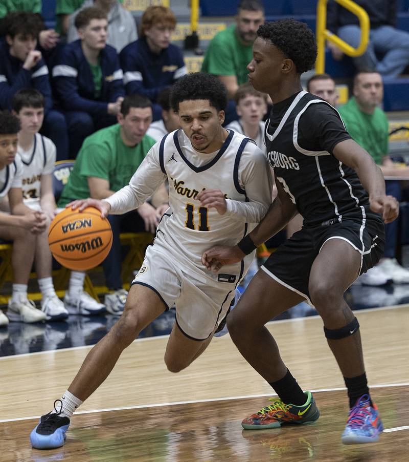 Sterling’s Quincy Maas handles the ball against Galesburg’s Keigen Crummer Tuesday, Feb. 10, 2026.
