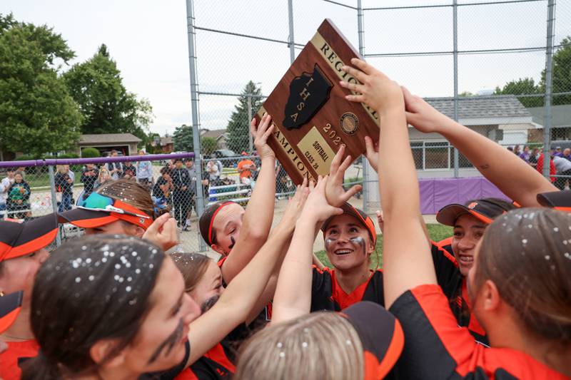Beecher's Liliana Irwin, center, celebrates with teammates following Beecher's 14-6 victory over Manteno in the Class 2A Manteno Regional championship on Friday, May 22, 2026.