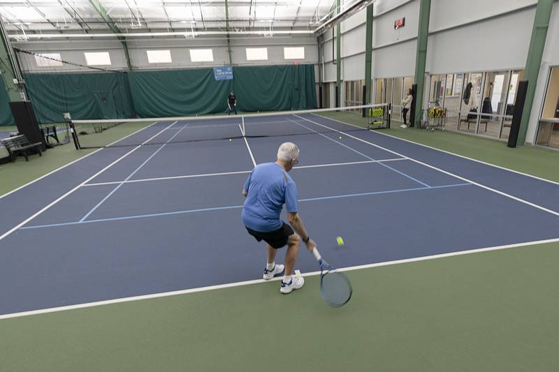 Bob Orta practices tennis with Westwood Tennis Pro Chris Dudley on Thursday, March 19, 2026.