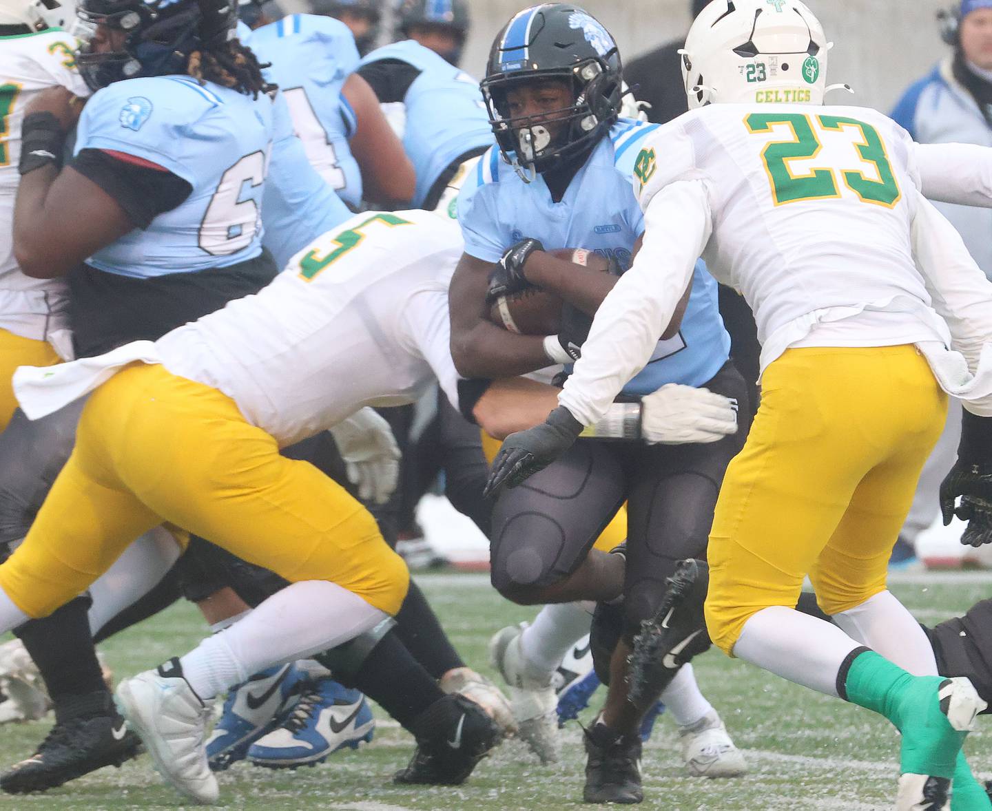 St. Francis's Tivias Caldwell Jr. runs with the ball against Providence Catholic during the Class 5A State championship on Tuesday, Dec. 2, 2025 in Hancock Stadium at Illinois State University in Normal.