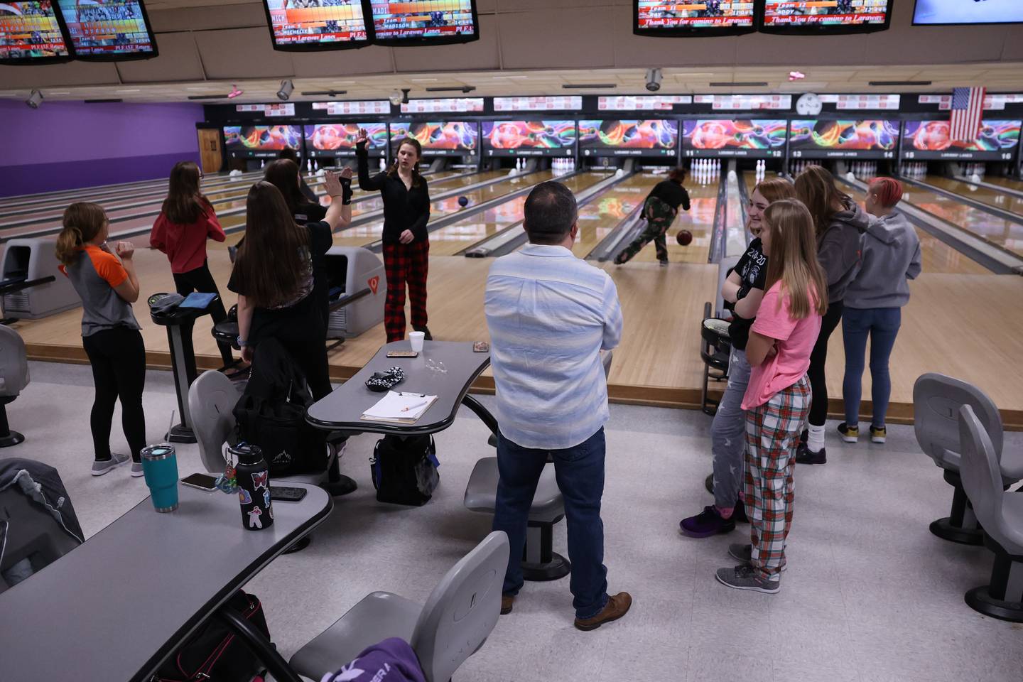 Lincoln-Way West’s bowling coach Scott Ullian watches as his team practices at Laraway Lanes in New Lenox.