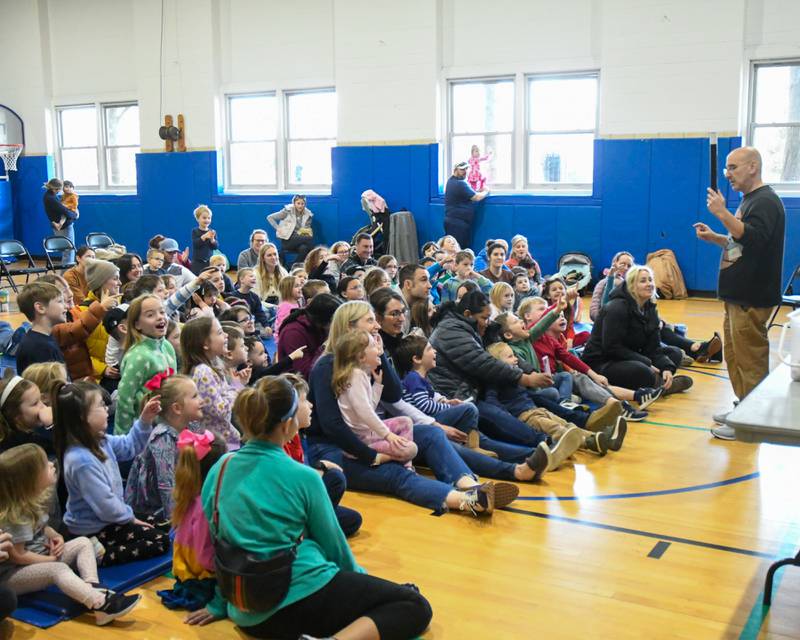 Community members look o as Gary Kantor preforms his magic show on Monday Feb. 19, 2024, held at the Main Street Recreation Center in Glen Ellyn.