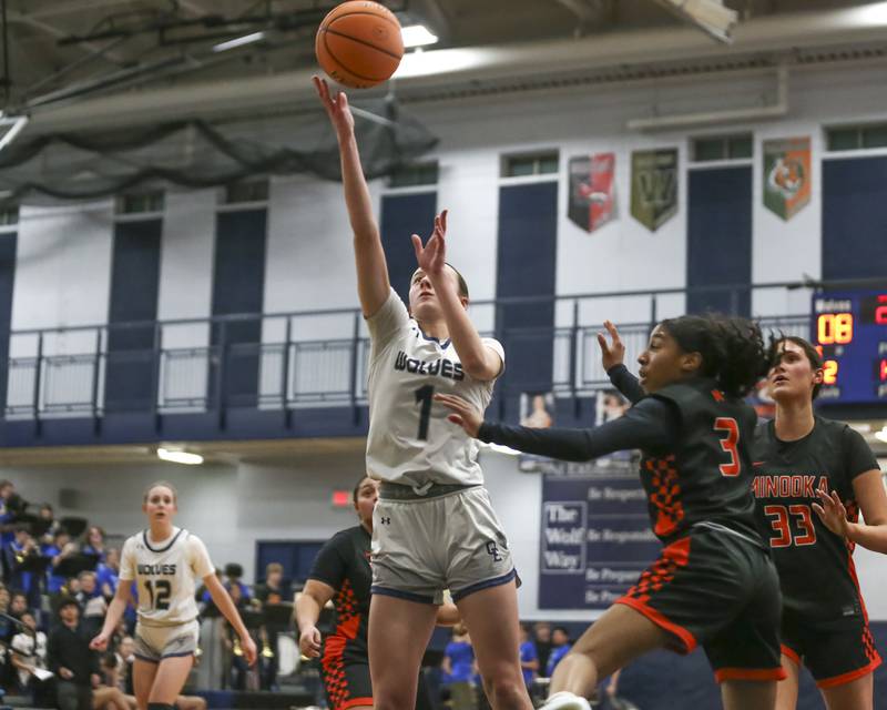 Oswego East's Aubrey Lamberti (1) puts in a layup during their basketball game between Minooka at Oswego East Friday, Jan 16, 2026 in Oswego.