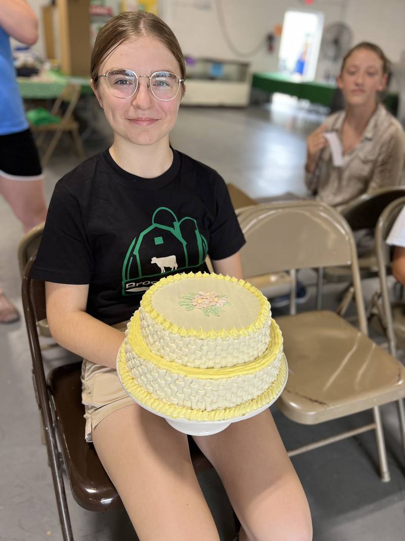 Jenna Green of Oswego waits her turn for visual arts judging in the cake decorating category.