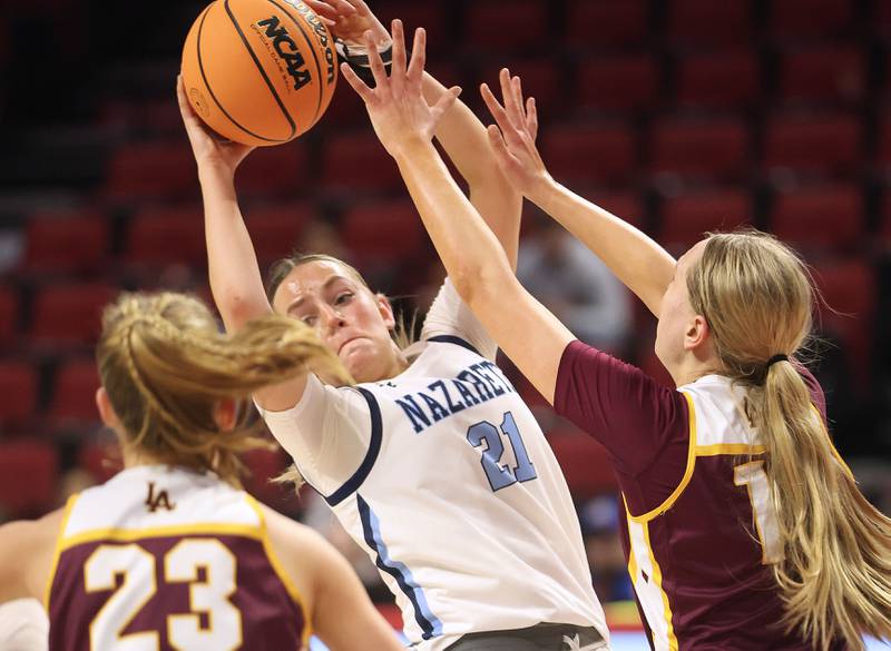 Nazareth's Lyla Shelton grabs a rebound over Loyola's Tess Walsh during the Class 4A State girls basketball championship game on Saturday, March 7, 2026 at CEFCU Arena in Normal.