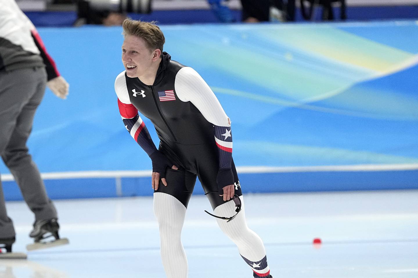 Austin Kleba of the United States reacts after falling during his heat in the men's speedskating 500-meter race at the 2022 Winter Olympics, Saturday, Feb. 12, 2022, in Beijing. (AP Photo/Ashley Landis)