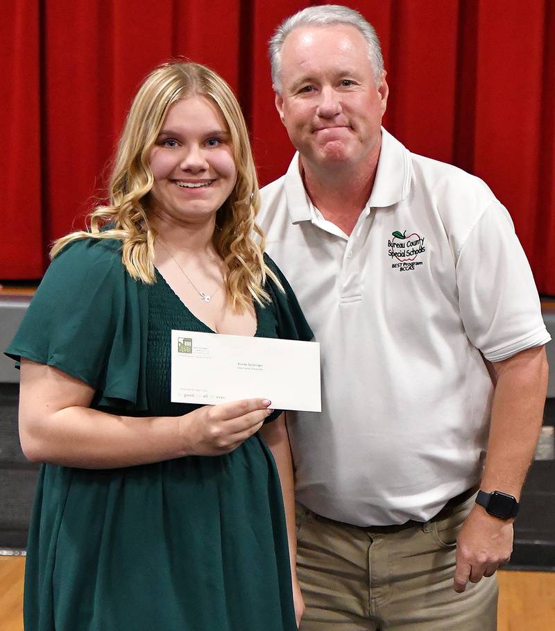 (Left to right); 2024 Indian Creek graduate Brooke Barshinger receiving a Hicks Family Scholarship from Egan Hicks