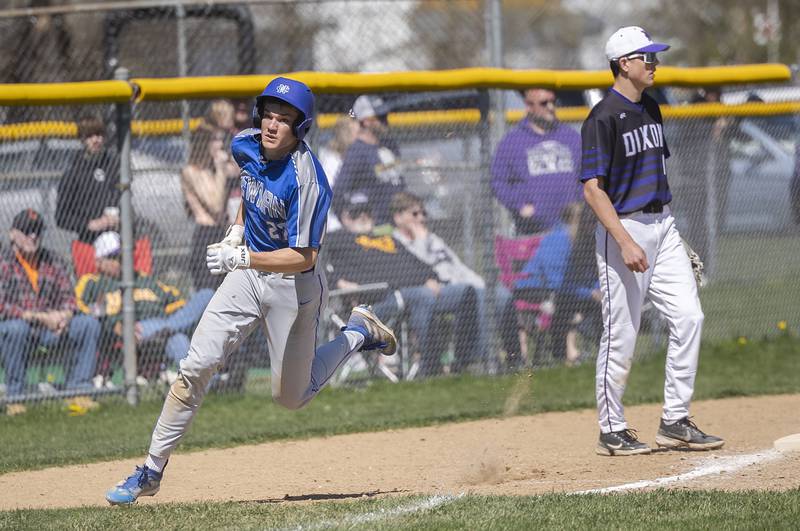 Newman’s Brendan Tunink rounds third base to score against Dixon Saturday, April 13, 2024 at Veterans Memorial Park in Dixon.