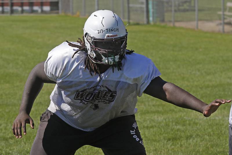 Prairie Ridge’s Gavin Tinch takes part in a drill during football practice Monday, July 1, 2024, at Prairie Ridge High School .