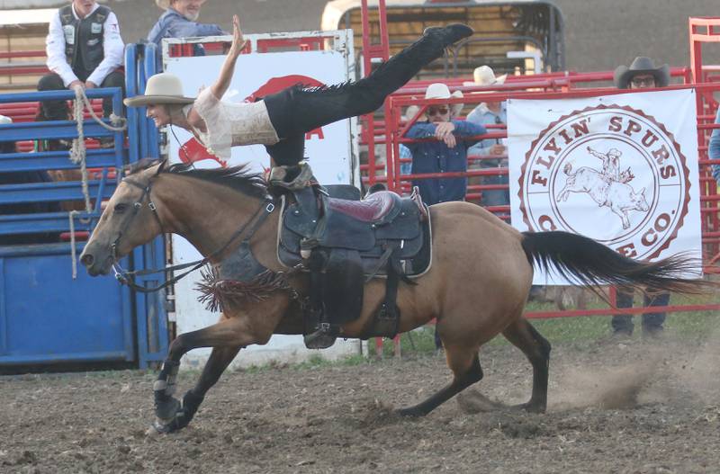 Shelby LeAnne Danison of Western Way Entertainment  performance company in Sevierville, Tenn., performs stunts on horseback during the Starved Rock Rodeo on Saturday, June 21, 2025 at the La Salle Speedway.