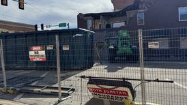 Laborers began demolition on Liberty St. building Friday