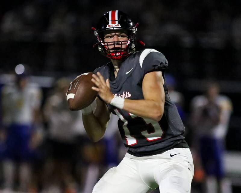Lincoln Way Central's Michael Kuehl (13) drops back to pass during football game between Sandburg at Lincoln Way Central.  Sept 22, 2023.