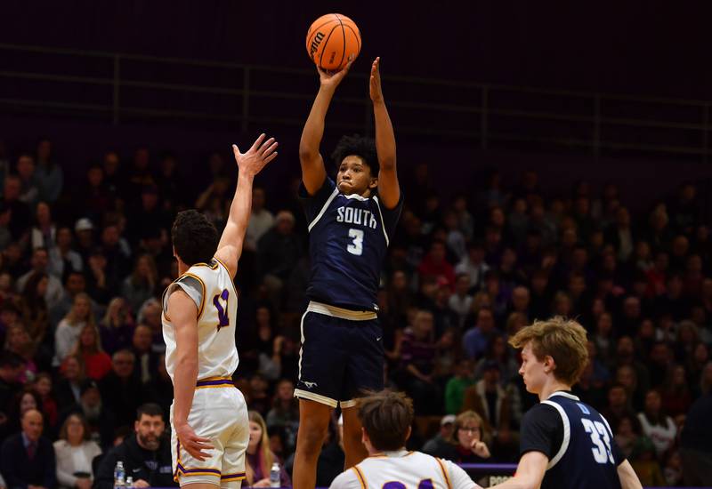 Downers Grove South’s Adam Flowers (3) launches a three pointer during a game against Downers Grove North on December 20, 2025 at Downers Grove North High School in Downers Grove.
