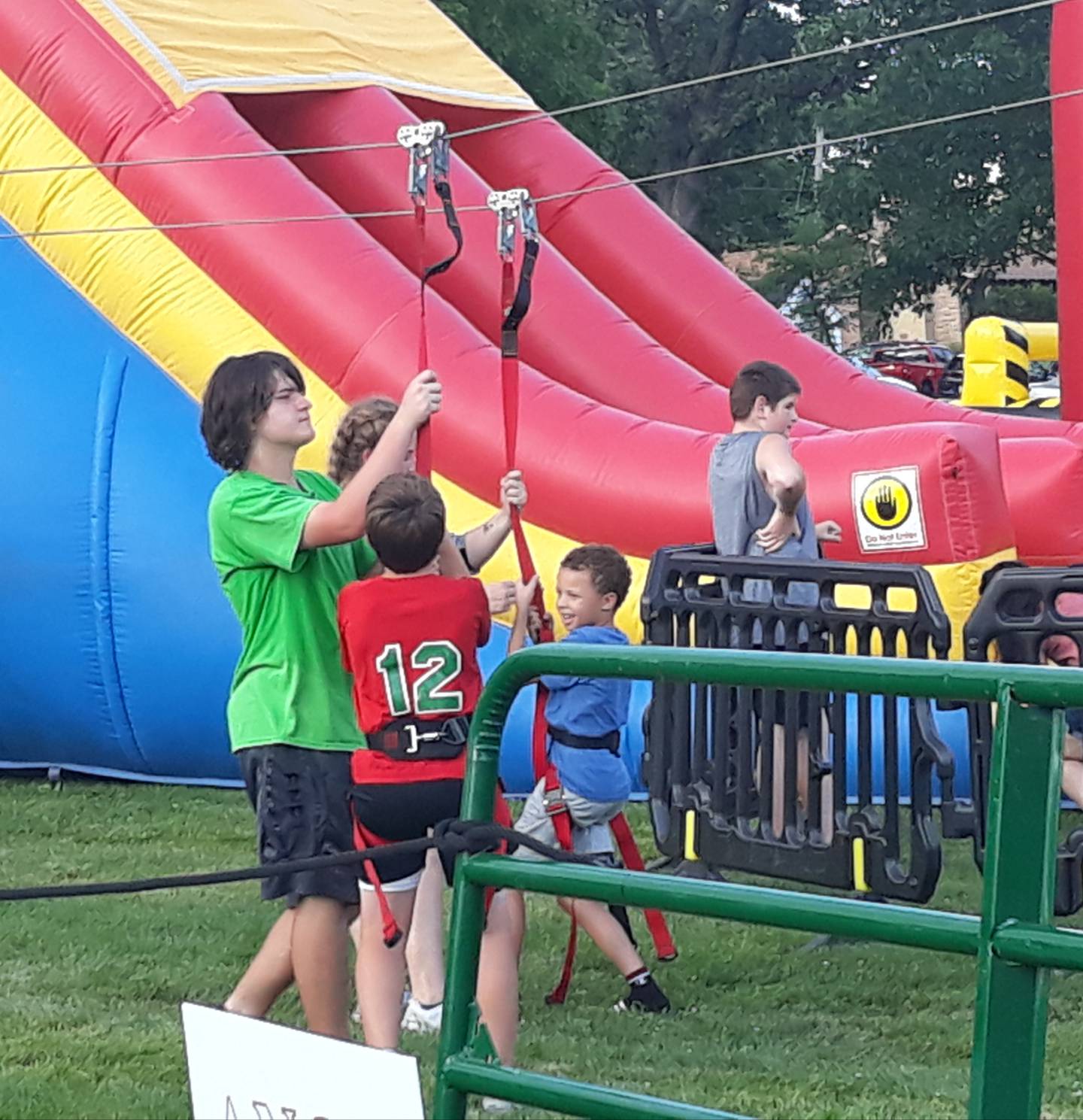 Children are all smiles after riding the zip line Thursday, Aug. 4, 2022, at the Taste of the Illinois Valley at Centennial Park in Peru.