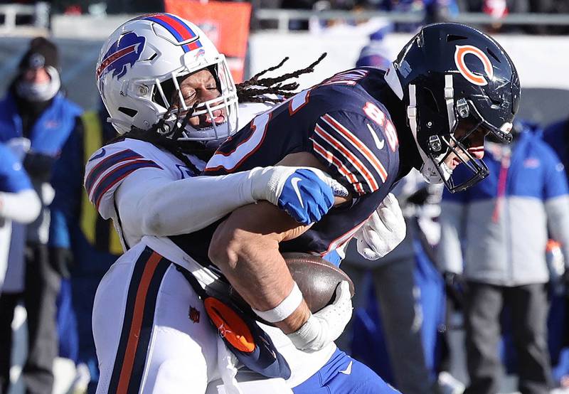 Chicago Bears tight end Cole Kmet tries to break the tackle of Buffalo Bills linebacker Tremaine Edmunds during their game Sunday, Dec. 24, 2022, at Soldier Field in Chicago.