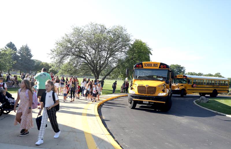 Students arrive on the first day of school at Louise White Elementary in Batavia on Wednesday, Aug. 16, 2023.