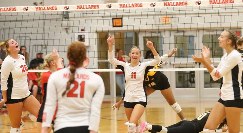 Members of the Henry-Senachwine volleyball team celebrate after winning the first set over Putnam County on Thursday, Aug. 28, 2025 at Henry-Senachwine High School.
