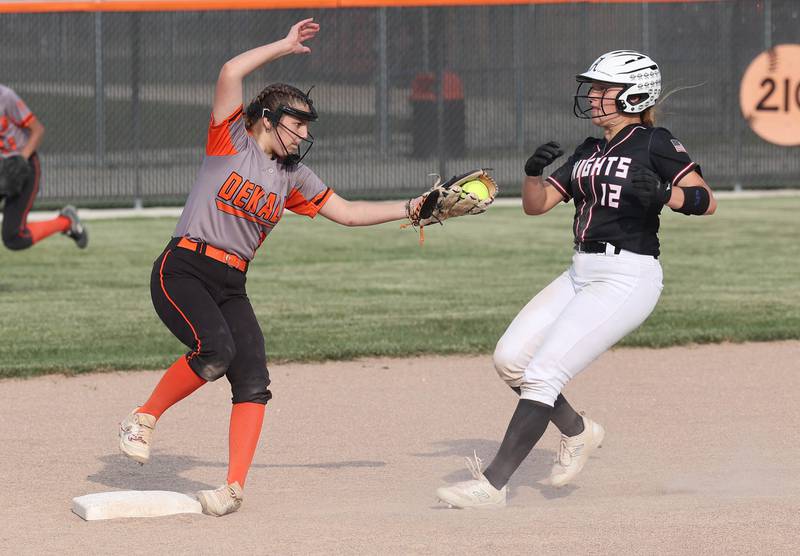 Dekalb's Madison Hallaron catches a bad throw but is still able to force out Auburn's Jalyn Yakey during their Class 4A regional game Wednesday, May 24, 2023, at DeKalb High School.