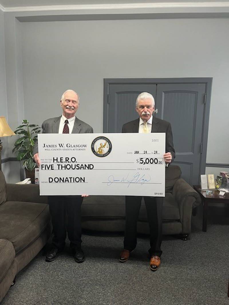 Will County State’s Attorney James Glasgow (right) recently donated $5,000 to the Heroin Epidemic Relief Organization, most commonly known as HERO. This recent $5,000 donation brings the state’s attorney’s financial contributions to HERO to more than $20,000. Glasgow is pictured with John Roberts, co-founder of HERO.