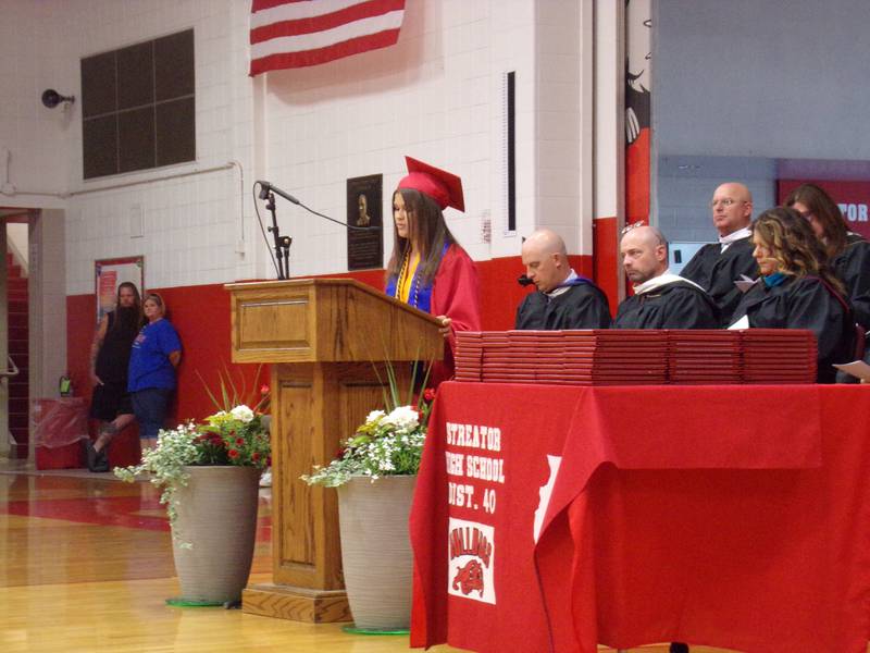 Charlee Bourell gives an opening message Sunday, May 21, 2023, during the Streator High School graduation ceremony at Pops Dale Gymnasium.