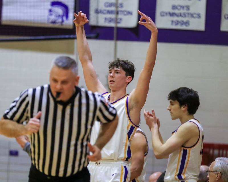 Downers Grove North's Jake Riemer (1) calls out a three point shot from the bench during varsity basketball game between Lyons at Downers Grove North.  Jan 31, 2023.