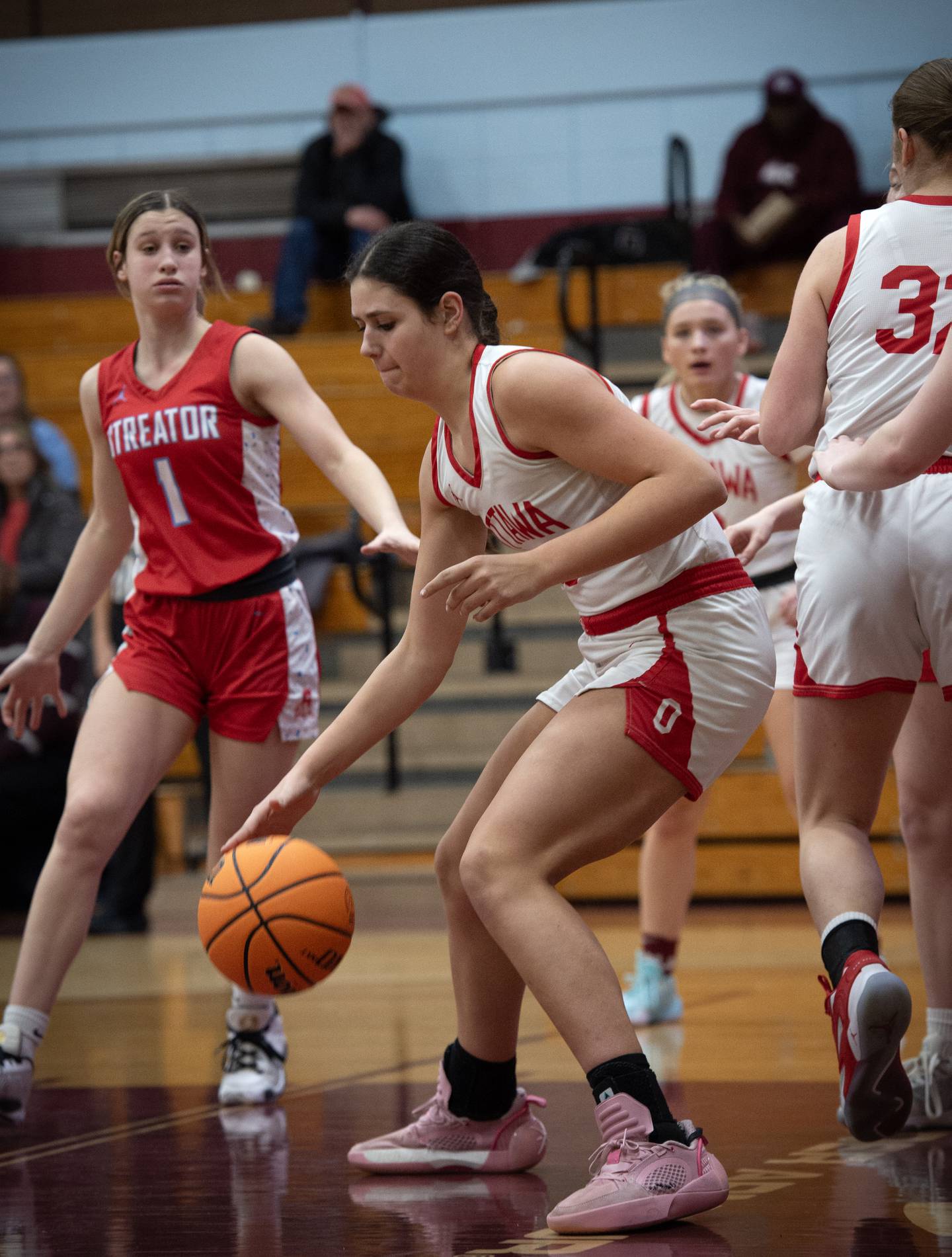 Ottawa's Bella Knoll controls the ball in the lane during an IHSA Class 3A Kankakee Regional semifinal against Streator Tuesday, Feb. 18, 2025.