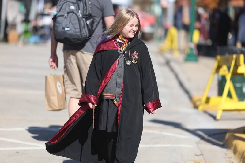 Emerson McCauley, 8, of Princeton walks along Liberty Street during the Magic in Morris event on Saturday.
