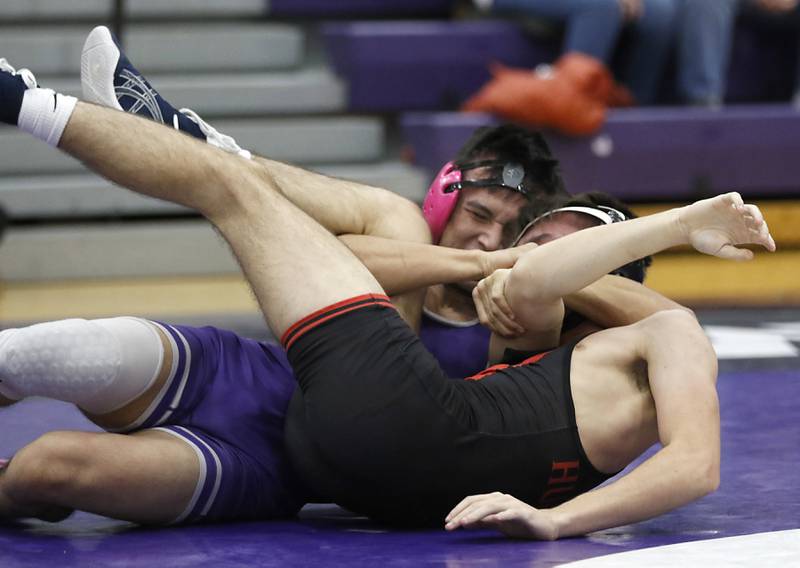 Hampshire's Chris Napiorkowski pins Huntley's Vlad Maluhin during the 150-pound match of a Fox Valley Conference wrestling meet on Wednesday, Jan. 8, 2025, at Hampshire High School.