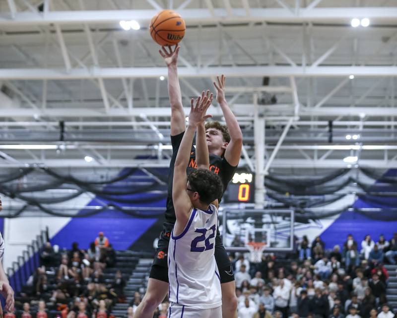 Sandwich's Griffin Somlock (4) draws a file during their basketball game between Sandwich at Plano Tuesday, Dec 9, 2025 in Plano.