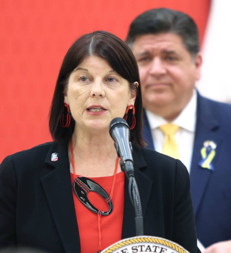 Northern Illinois University President Lisa Freeman speaks as Illinois Gov. JB Pritzker looks on Thursday, March 3, 2022, in the Barsema Alumni and Visitors Center at NIU in DeKalb.