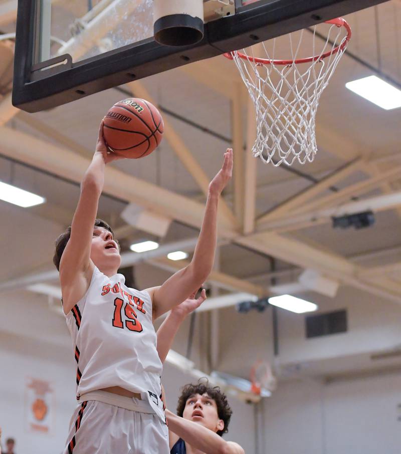 Wheaton Warrenville South's Nick Brooks (15) takes a shot against Lake Park during a game on Saturday, Jan. 7, 2023.