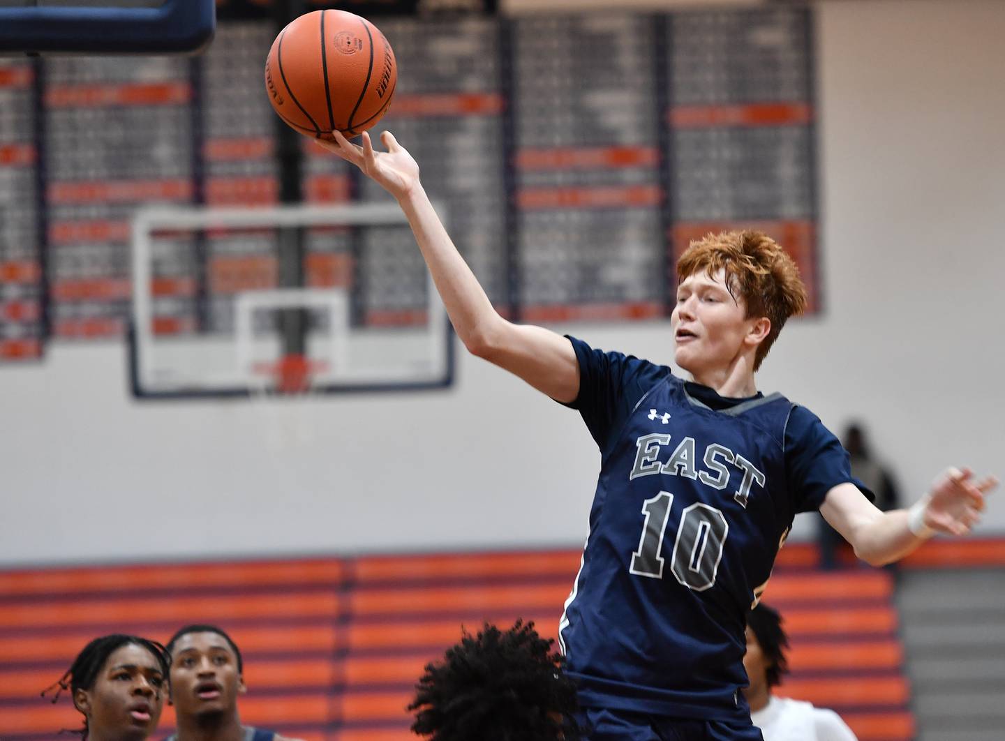 Oswego East's Noah Mason finger rolls the ball to the basket during a Hoops for Healing tournament game against West Aurora on Nov. 20, 2023 at Naperville North High School in Naperville.