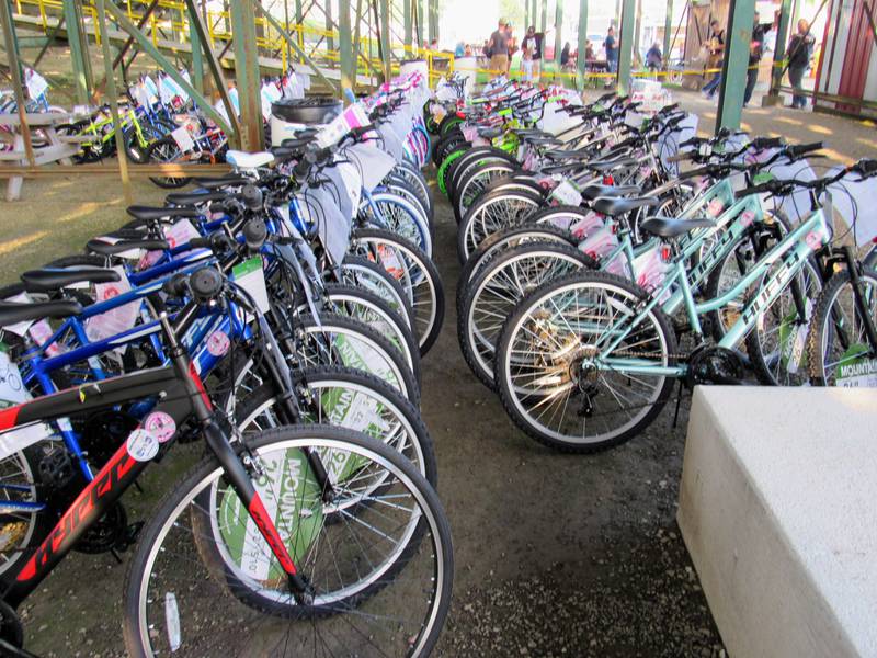 Bikes line the area under the grandstands to be given away later in the night.