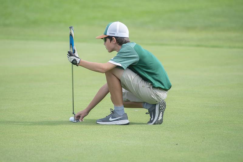 St. Bede’s Abraham Wiesprock lines up his putt on #10 in Rock Falls Saturday, Sept. 3, 2022.