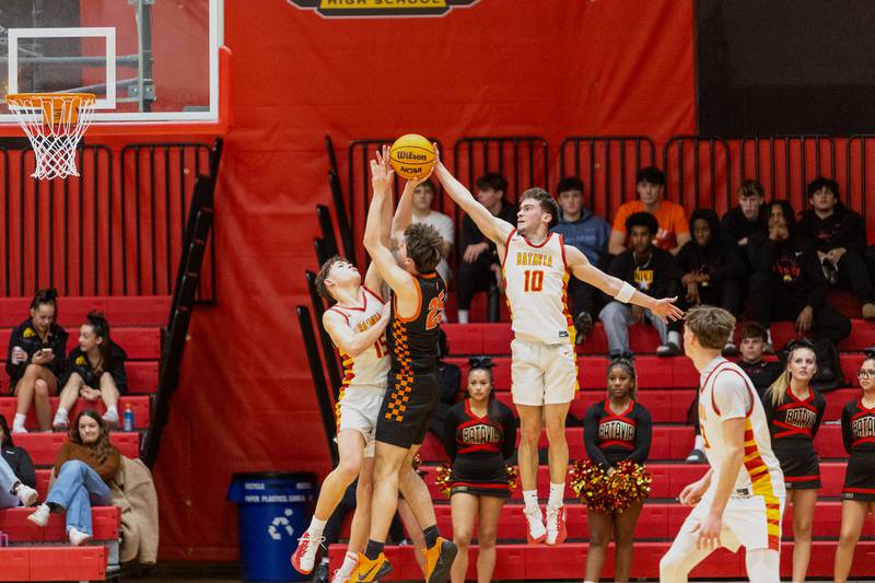 St. Charles East's Gavin Belli has his shot blocked from behind by Batavia's Joe Reid on Friday, Jan.9,2026 in Batavia.