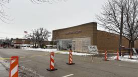 Roof of downtown Woodstock business collapses, road shut down amid concerns of further damage