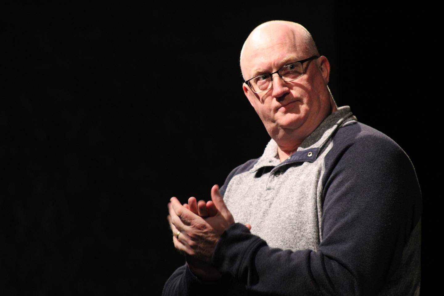 Timothy Schlegel, drama instructor, introduces Sterling High School's cast for "CODA," which was its entry in the 2022 group interpretation state preliminaries during a preview presentation at Centennial Auditorium.